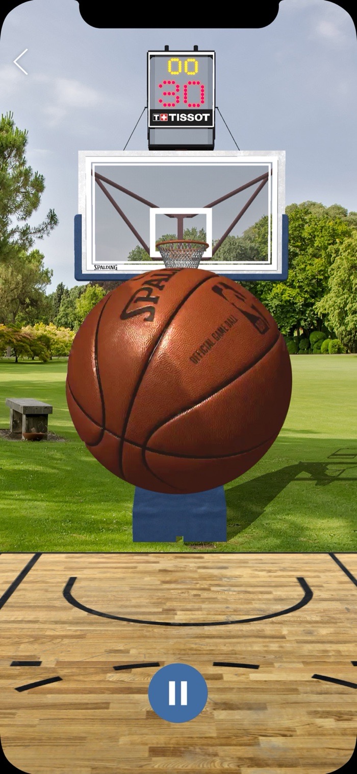 NBA AR pop-a-shot gameplay: an official game ball flying toward an AR hoop with a shot clock, overlaid on a park